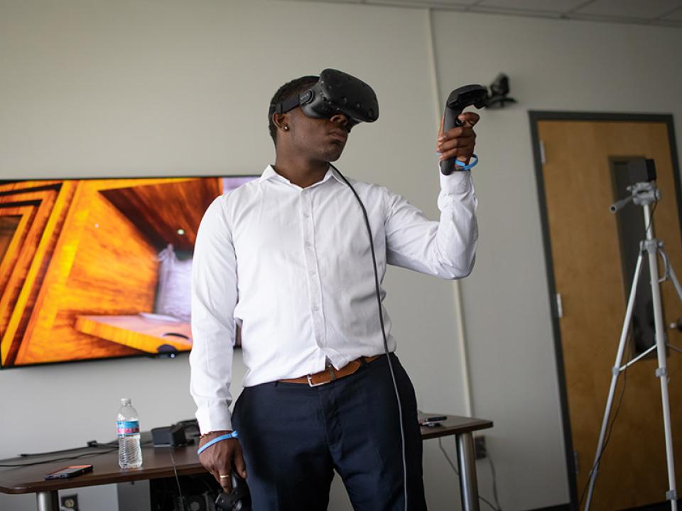 A student in a Virtual Reality (VR) headset