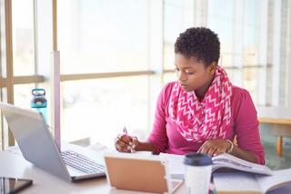 a young female college student studying