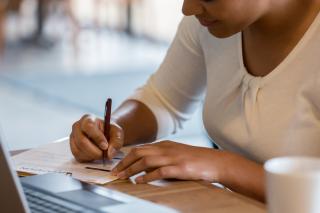 Women writing with a pen